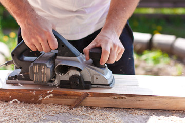 Carpenter with electric planes
