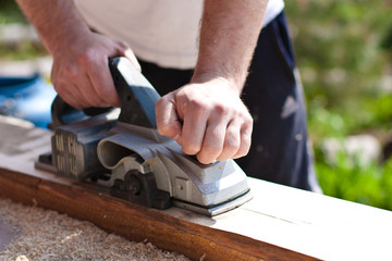 Carpenter with electric planes