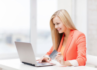 businesswoman with laptop and credit card