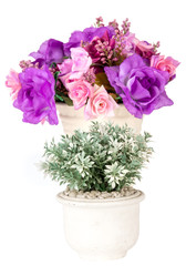 Artficial flowers in white vase isolated