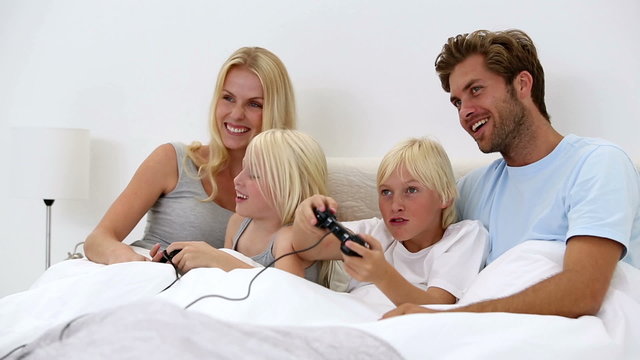 Parents watching their chidren play video games