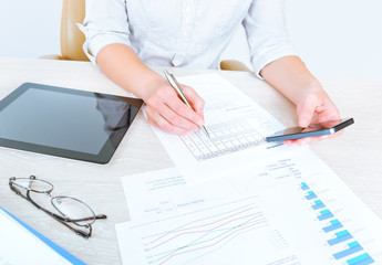 Business person analyzing statistics