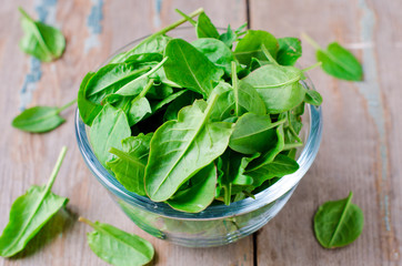 Spinach in a glass bowl on the table