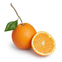 ripe round oranges with half, stem and leaf