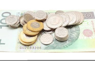 Banknote and coins on white background