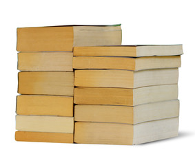 Stack of used pocket books isolated on white, clipping path.