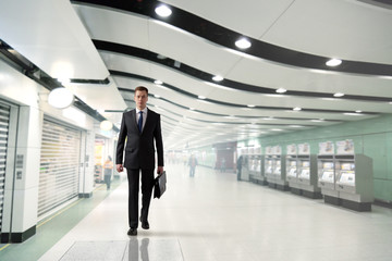 business man walking in subway