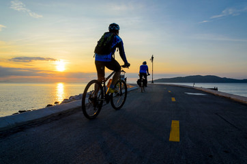 Bicycle ride with morning sun rise