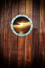 Boat porthole with ocean view