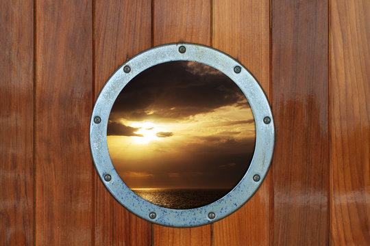 Boat porthole with ocean view