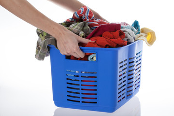 Hands with basket of laundry