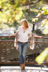 Beautiful young woman in autumn park