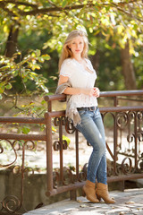 Beautiful young woman in autumn park