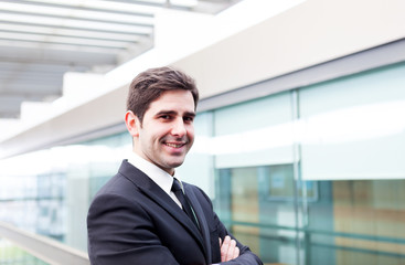 Fototapeta premium Young business man smiling at the office