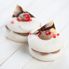 Close-up of two fancy biscuits on wooden boards, studio shot