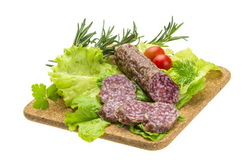 Salami with rosemary, salad and tomatoes