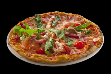 pizza with arugula, cherry tomatoes, prosciutto isolated on blac