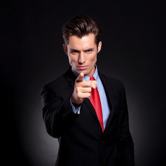 business man pointing at you