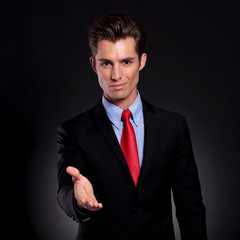 business man puts out hand