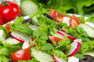 Salad with tomatoes, cucumbers  and olives