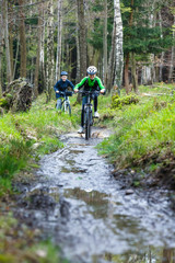 Naklejka premium Healthy lifestyle - teenage girl and boy biking