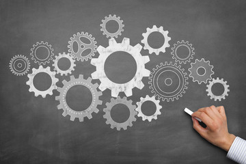 Blackboard with cogwheels