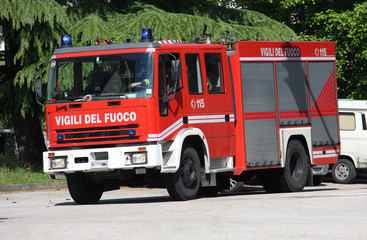 fire truck arrives in speed to put out the fire in the city