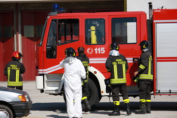 Firefighters prepare for the tools from the truck during a serio