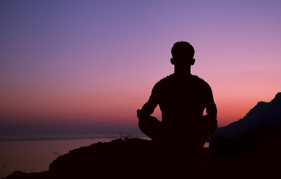 Sitting Man Silhouette In Meditation Pose