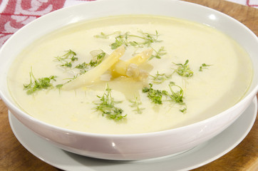 asparagus cream soup in a white bowl