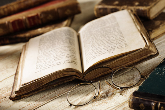 antique book with old spectacles