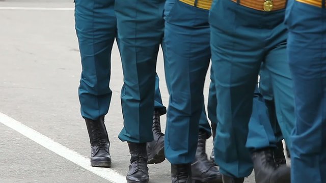 Formation of soldiers in dress parade uniform.