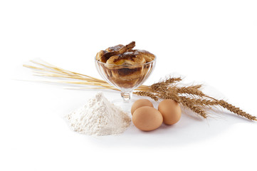 Puff pastry in piala, eggs, flour, spikelets on white background