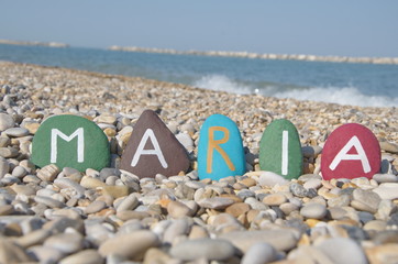 Maria, female name on colourful stones