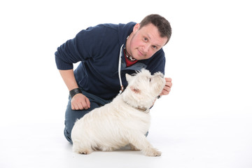 dog sitting with owner on white background