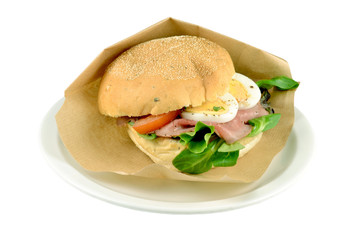 Roll roast beef on a white background.