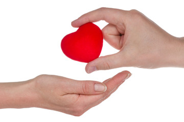 Fototapeta premium Male and female hands giving heart