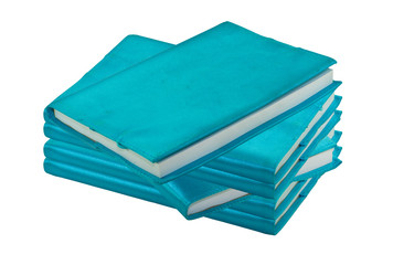 Stack of blue notebook on white