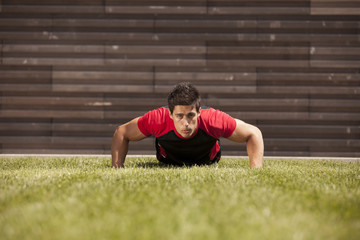 Fototapeta premium Athlete making some pushup