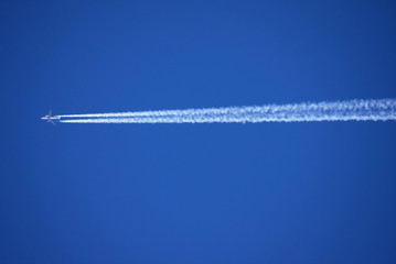 airplane and vapour trail
