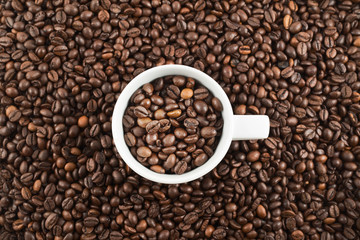 Cup full of coffee beans