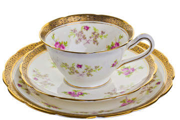 Antique tea cup, saucer and small plate.