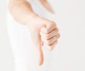 woman showing thumbs down