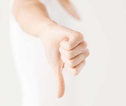 Woman Showing Thumbs Down