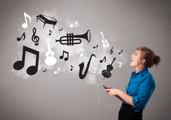 Beautiful young woman singing and listening to music with musica