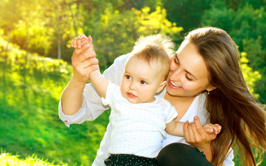 Beautiful Mother And Baby outdoors. Nature