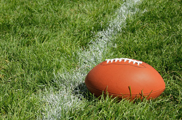 American Football on Natural Grass Field