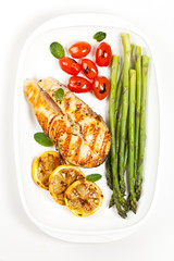 Grilled salmon steak with asparagus and cherry tomatoes