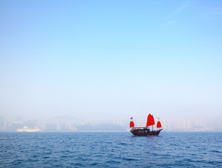 Sailboat sailing in victoria harbor at Hong Kong