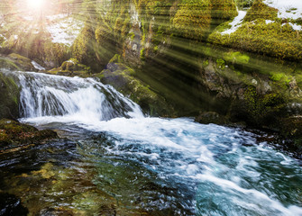 mountain river in winter and sunrise